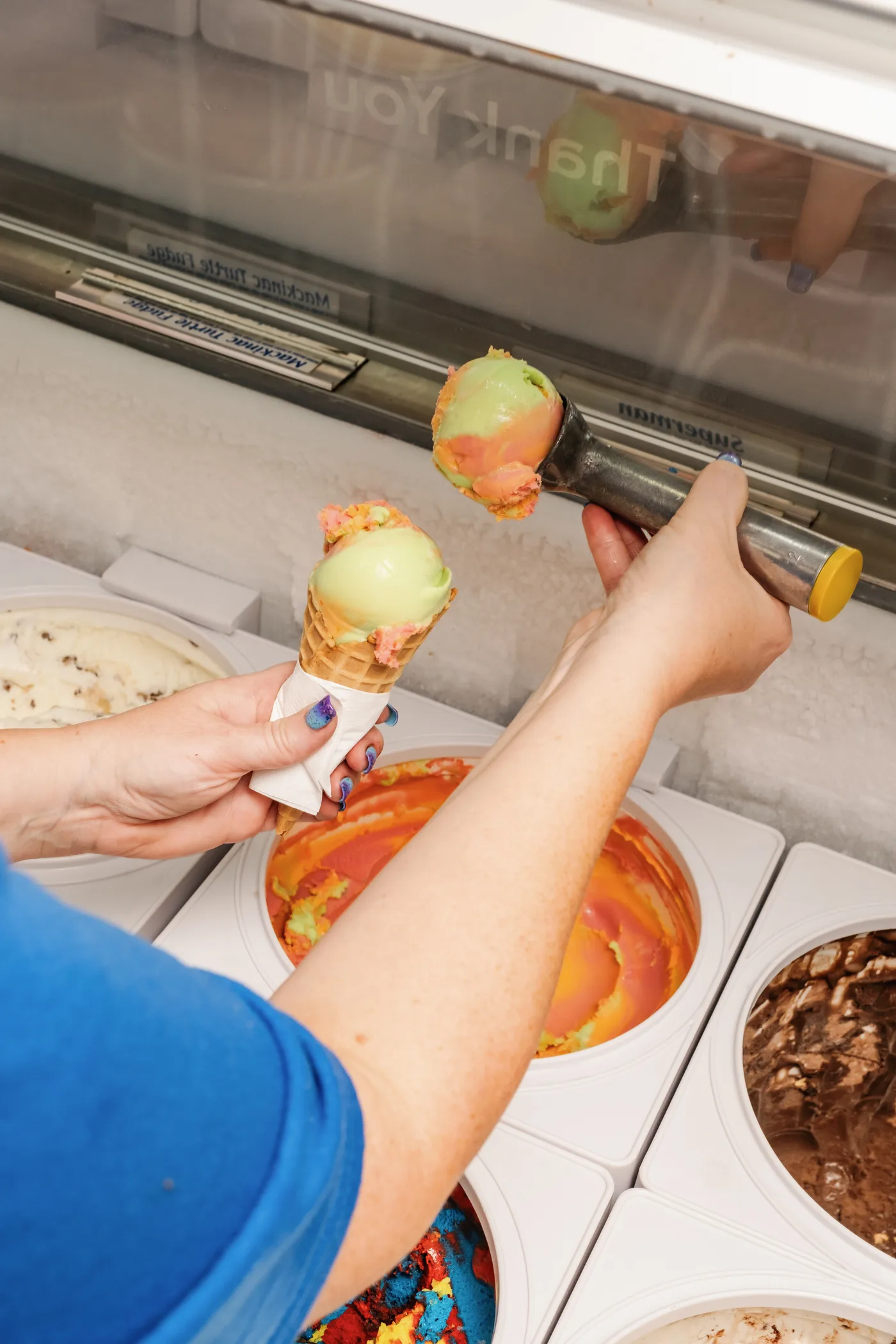 Colorful ice cream cone being scooped at Campbell's Dairyland