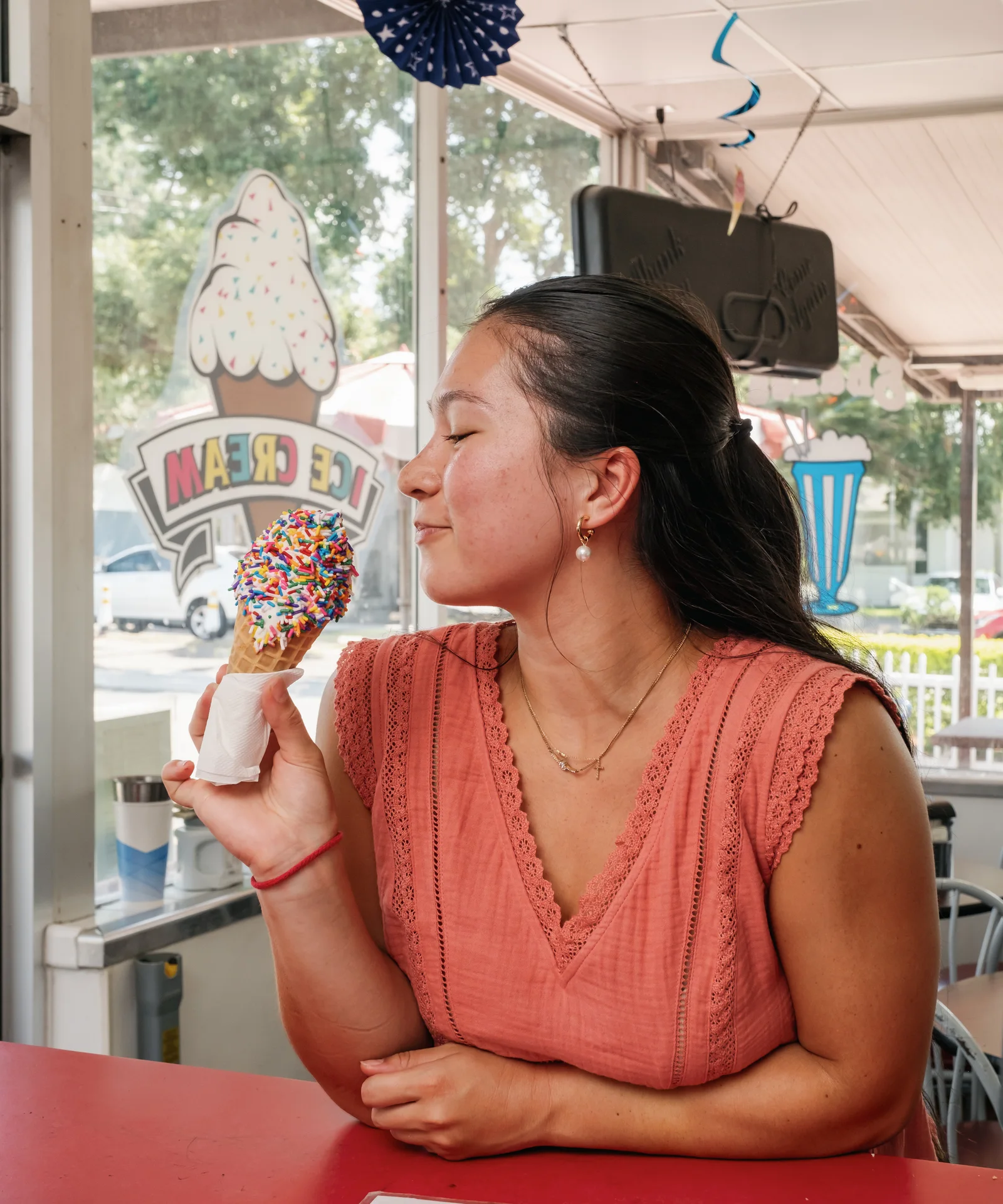Guest enjoying a sprinkle cone at Campbell's Dairyland in Brandon